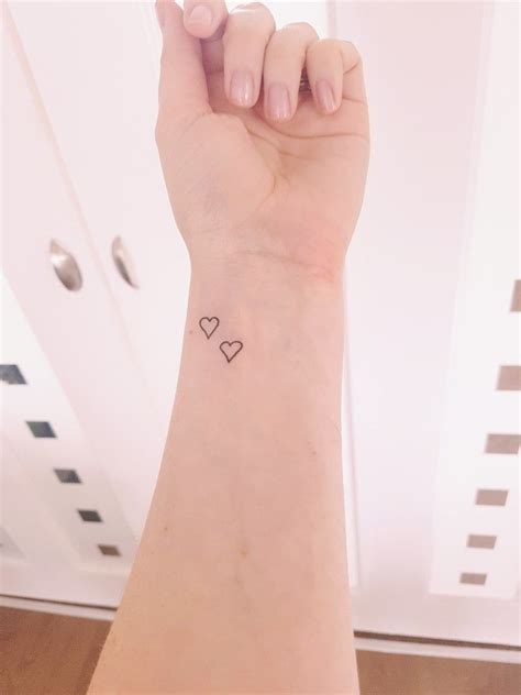 dainty heart tattoo